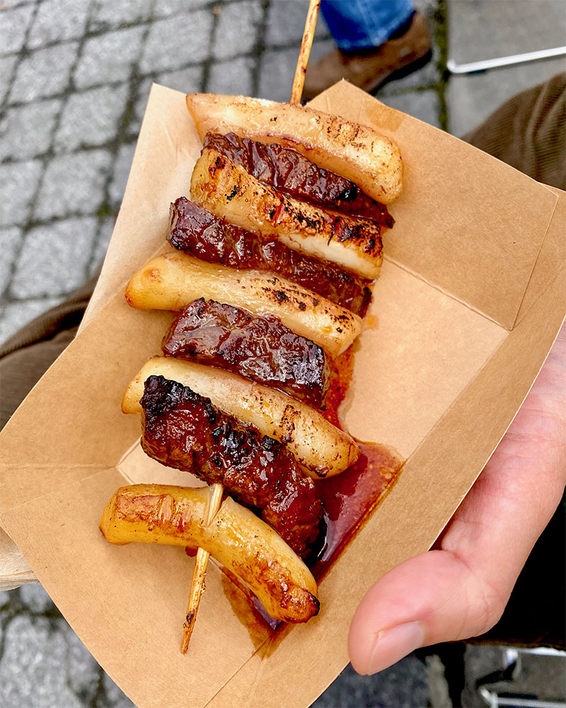 a skewer with tteobokki and galbi