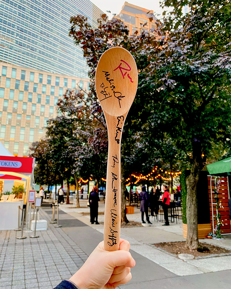 a wooden spoon with signatures