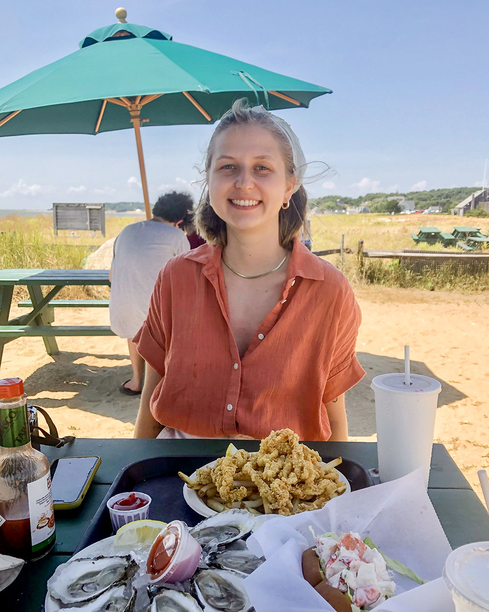 a picture of me with a plate of fried seafood and oysters